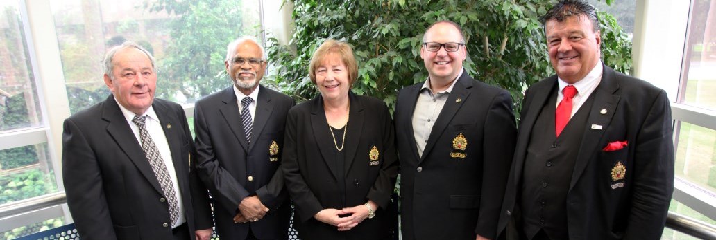 Board members standing together smiling