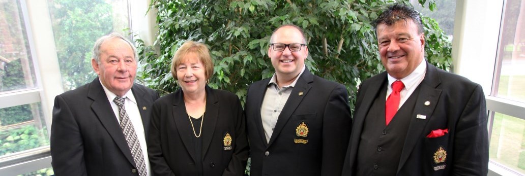 Board members standing together smiling