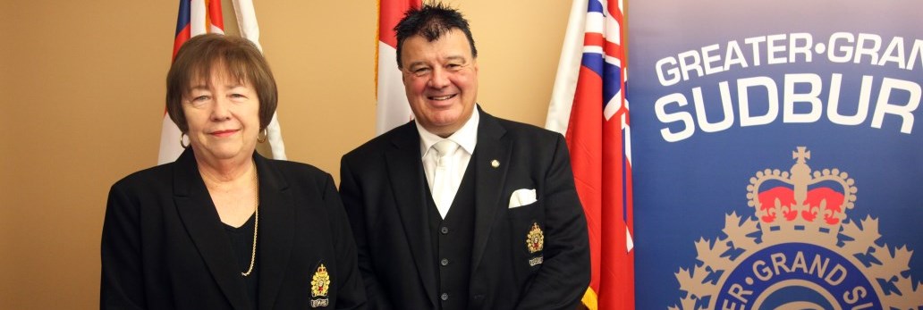 two people standing next to GSPS banner