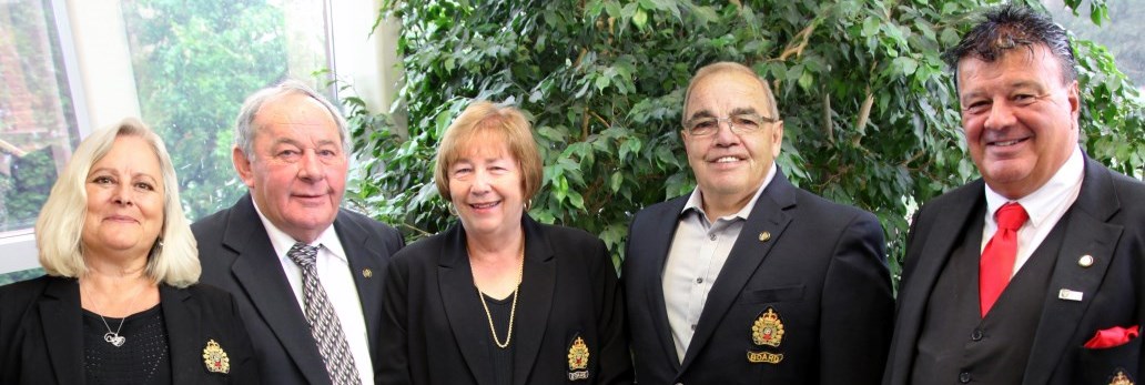 Board members standing together smiling