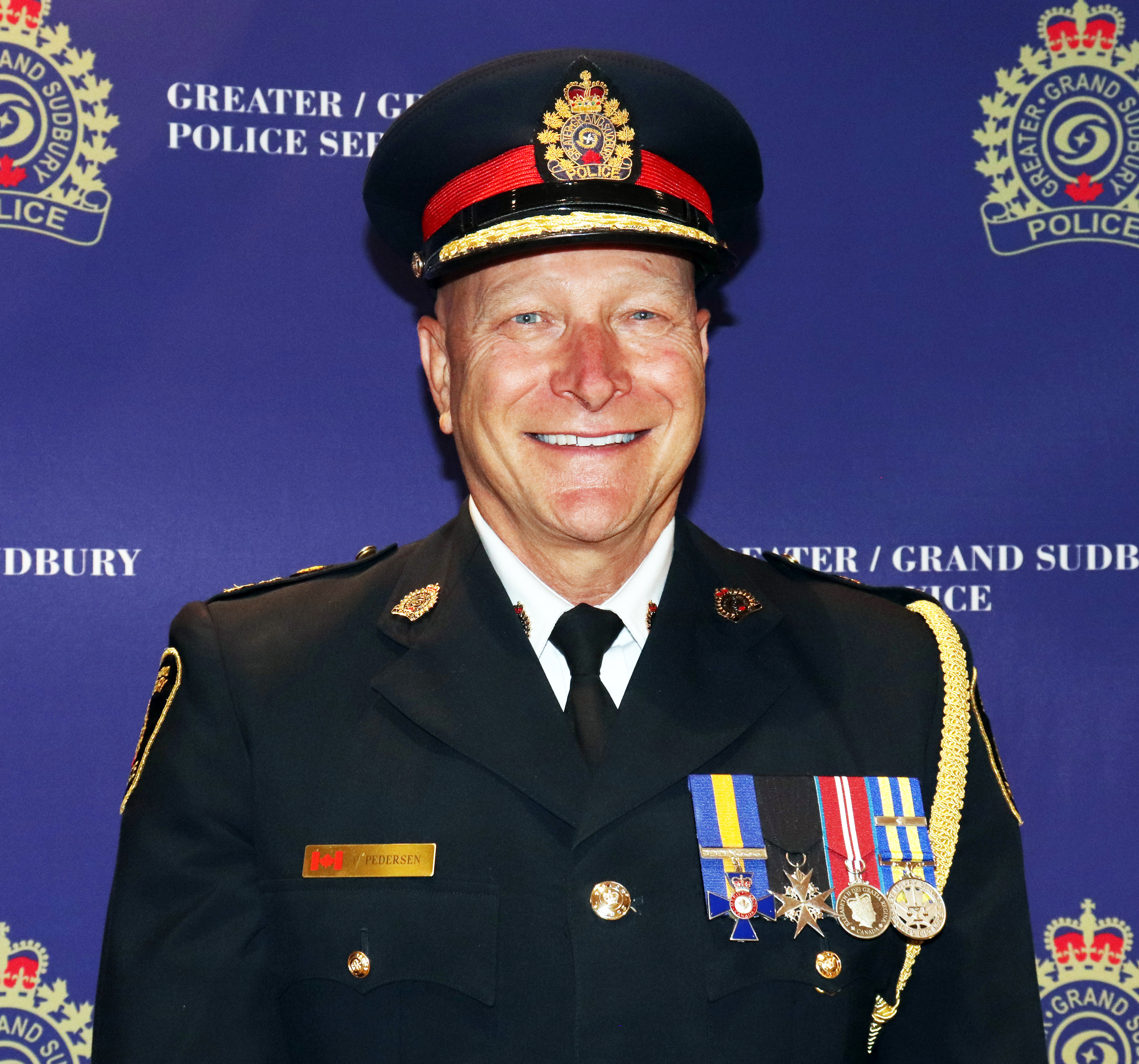 Chief of Police smiling wearing uniform