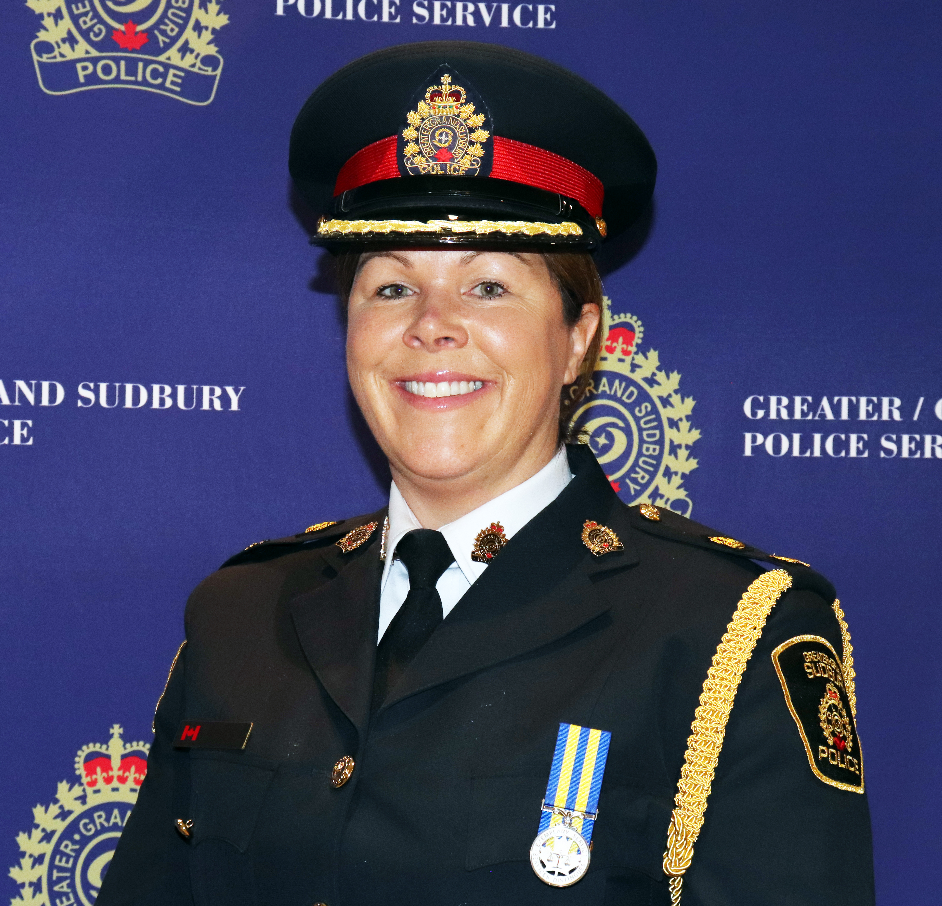 Deputy Chief of Police in uniform smiling