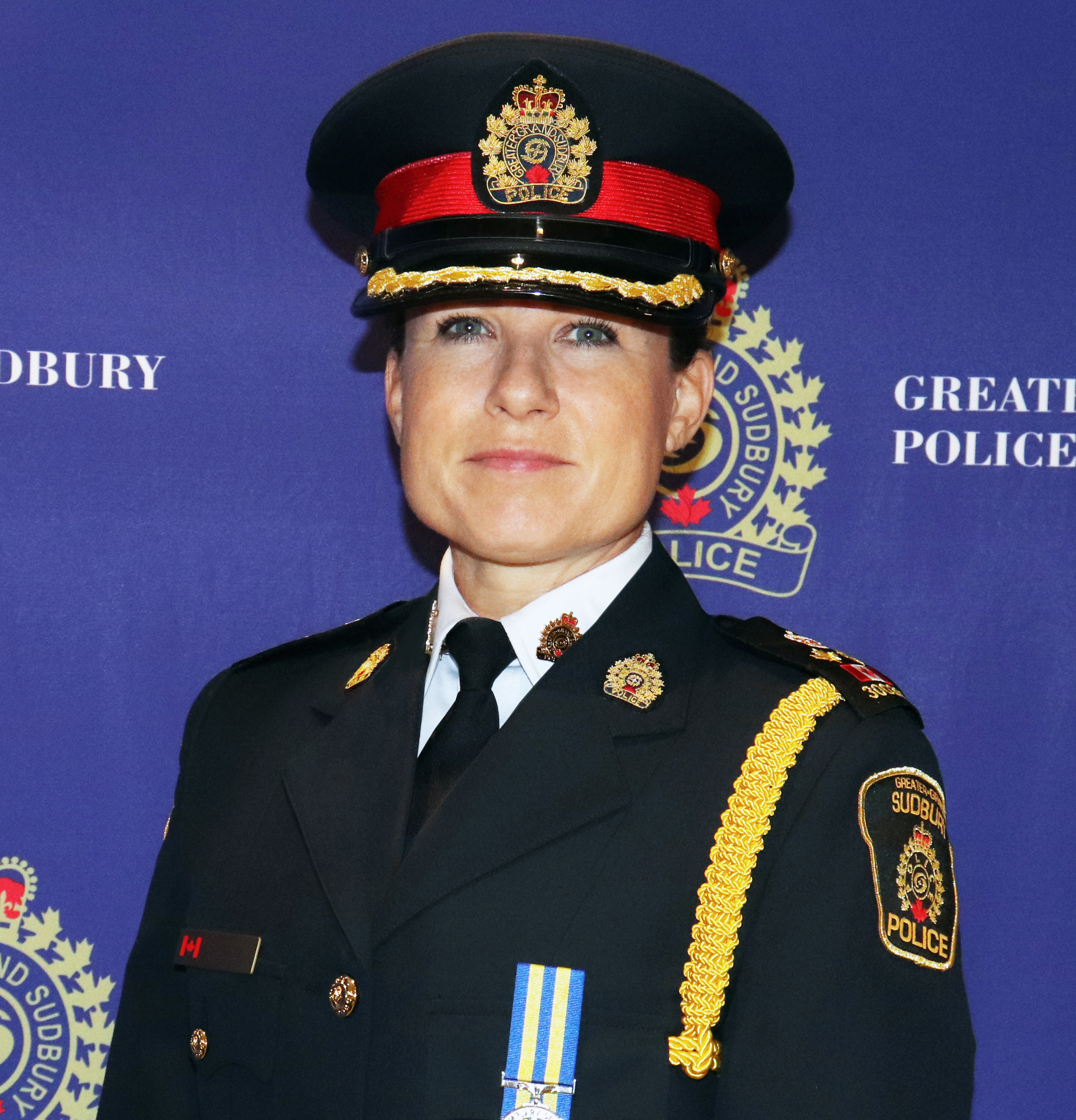 Deputy Chief of Police in uniform smiling