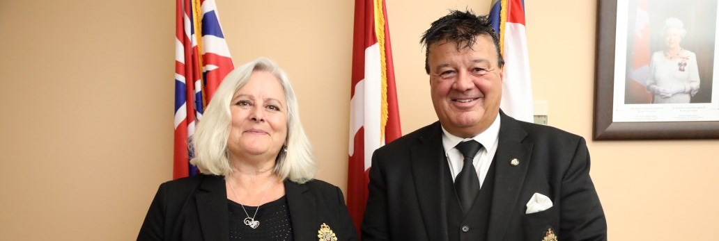 two people standing next to GSPS banner