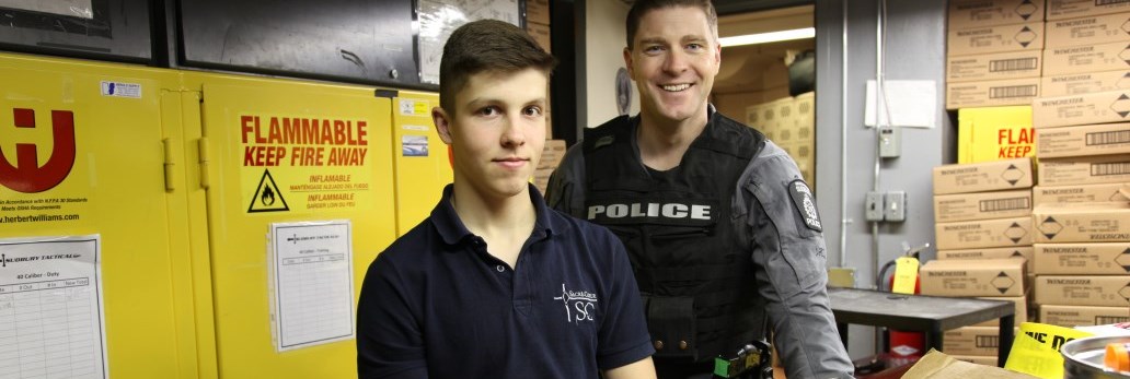 male student with Tactical Officer smiling