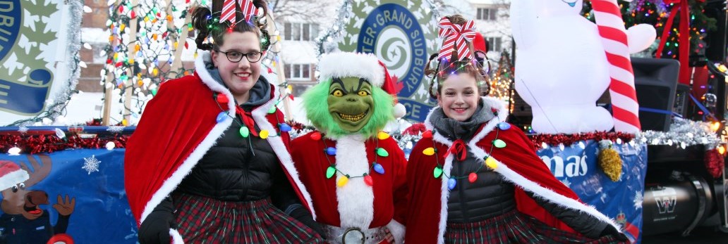 youth dressed up for christmas parade smiling