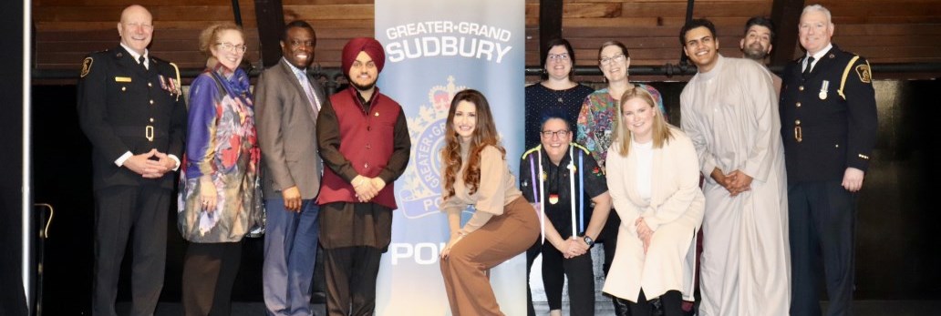 group of multicultural people standing together smiling