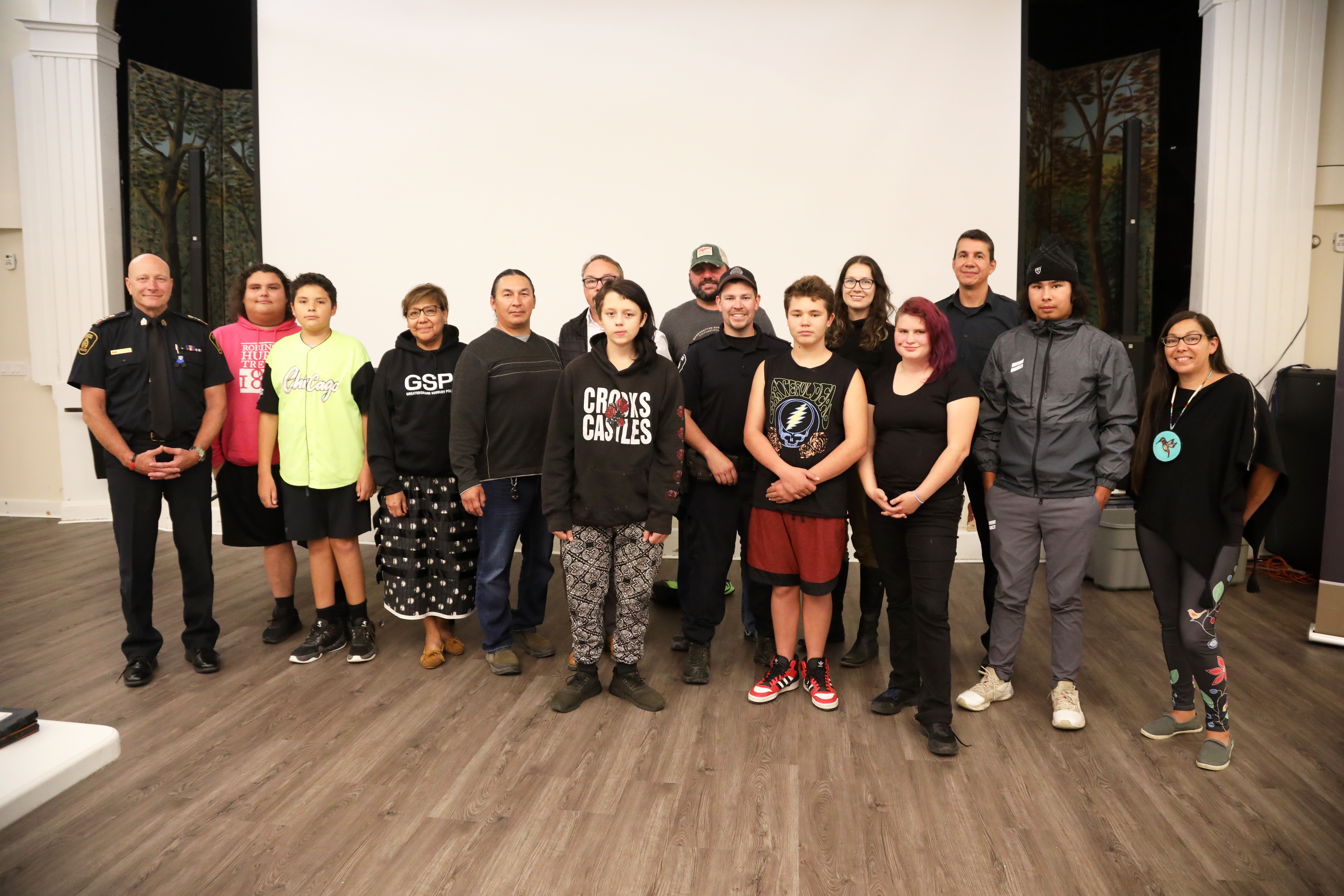 group of people standing smiling