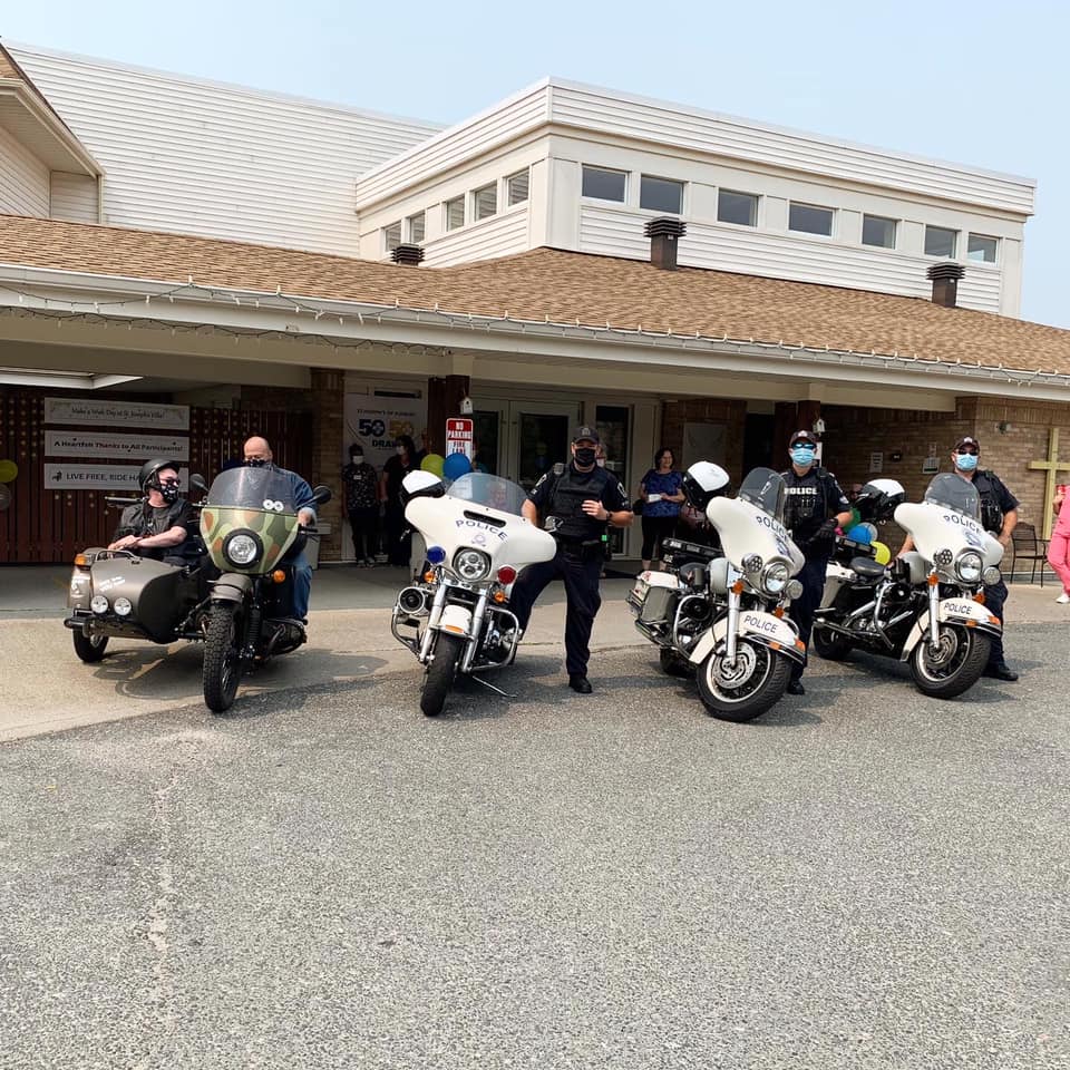 people posing with motorcycles