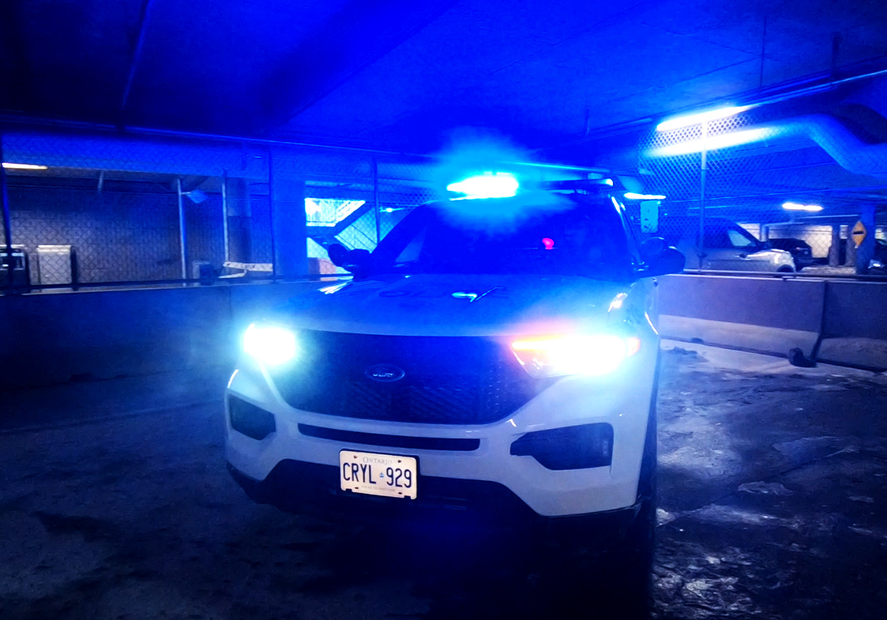 police cruiser with blue lights flashing