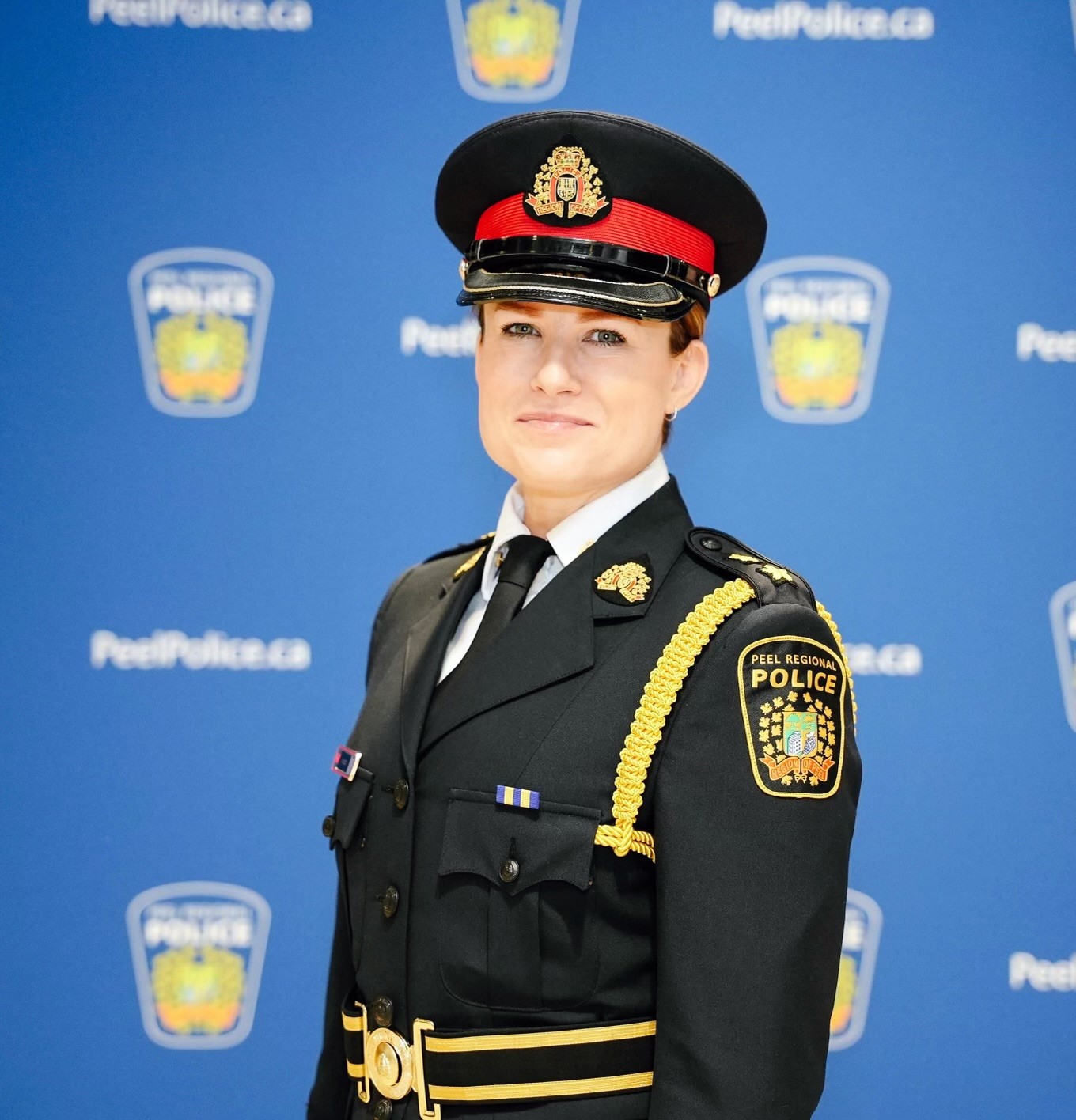 deputy chief of police smiling wearing uniform