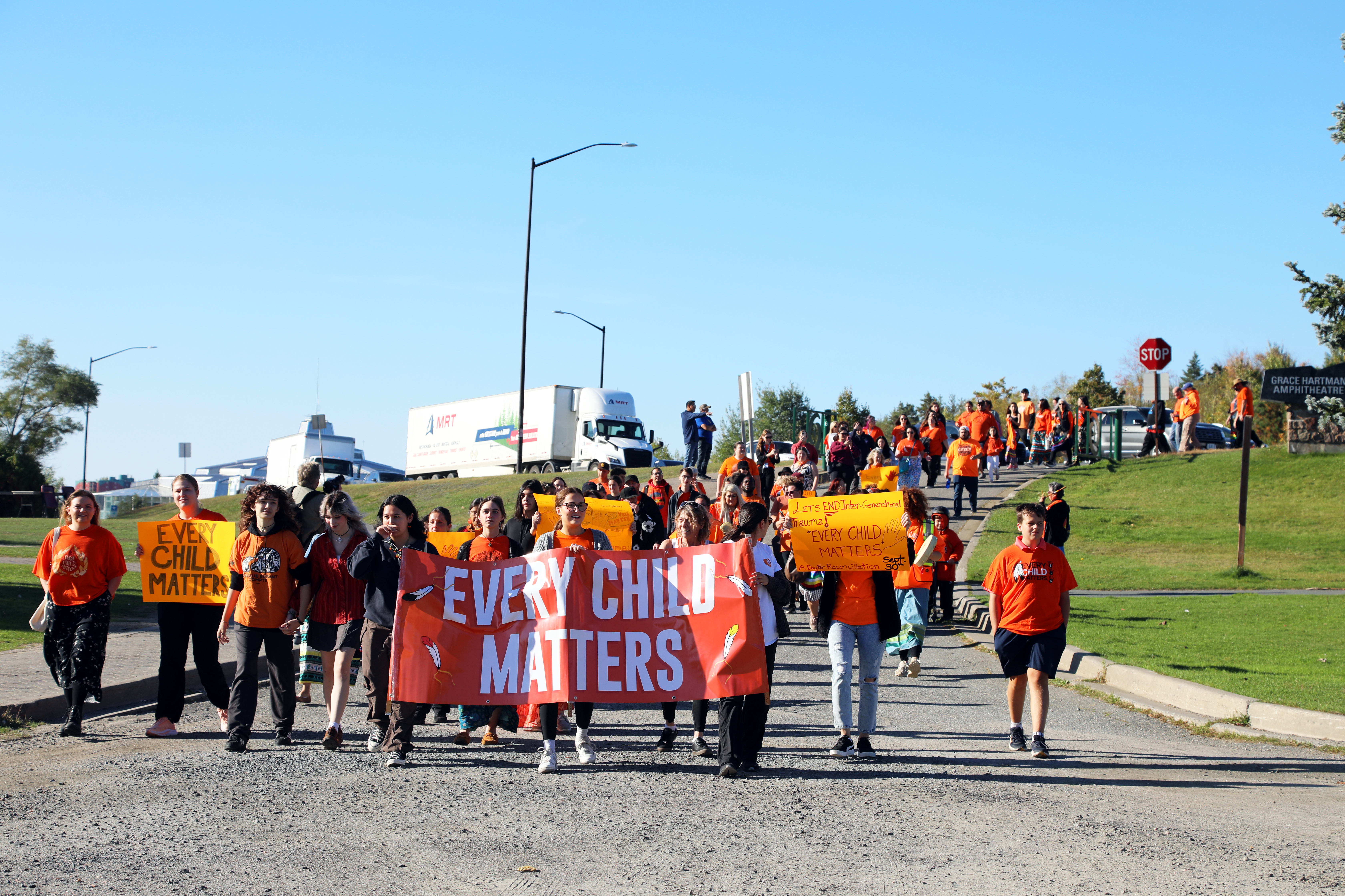 group walking holding signs