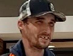 Photo of suspect man wearing basball cap, brown hair, brown eye with missing front tooth