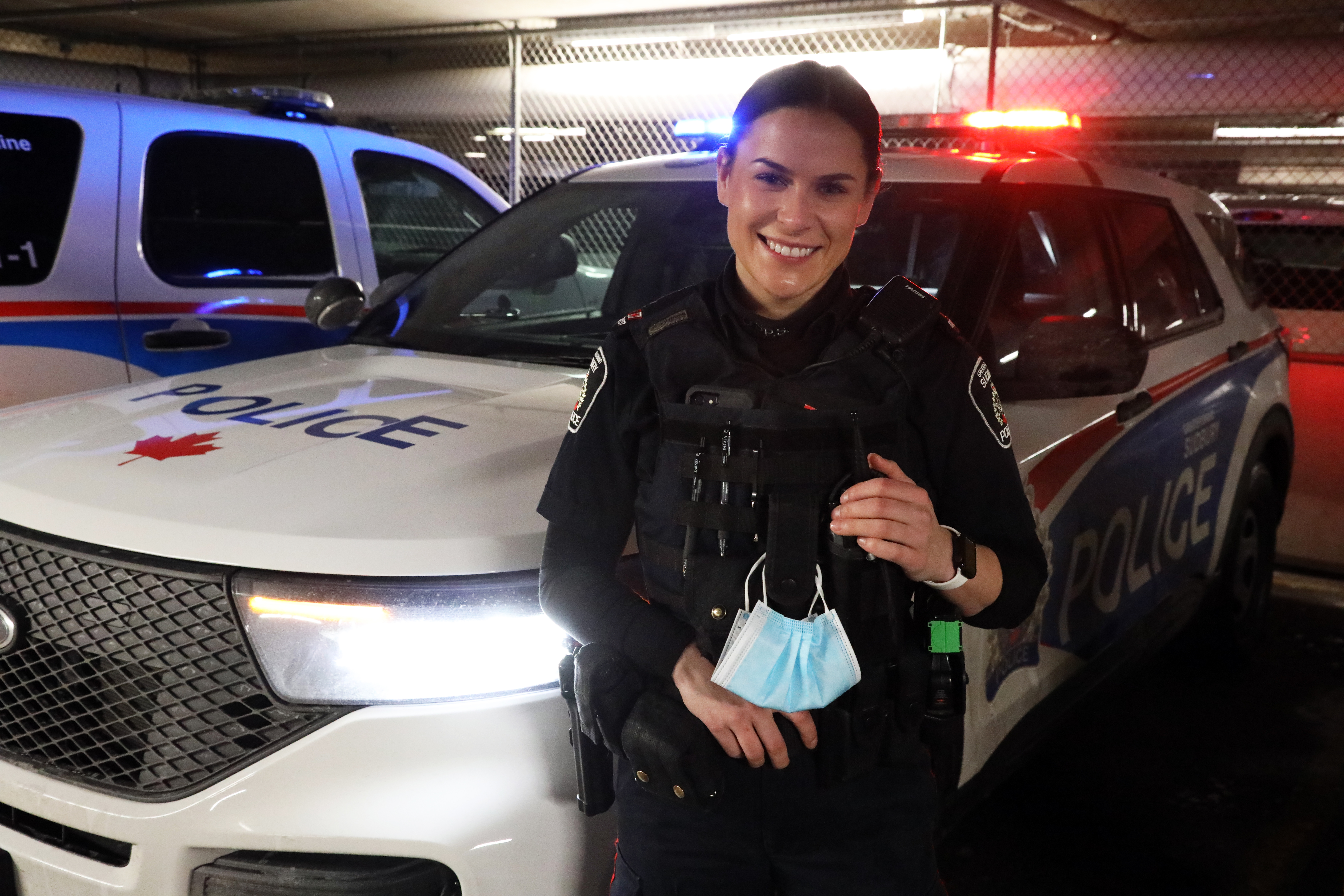 Cst. Karly Gosselin police officer standing beside cruiser