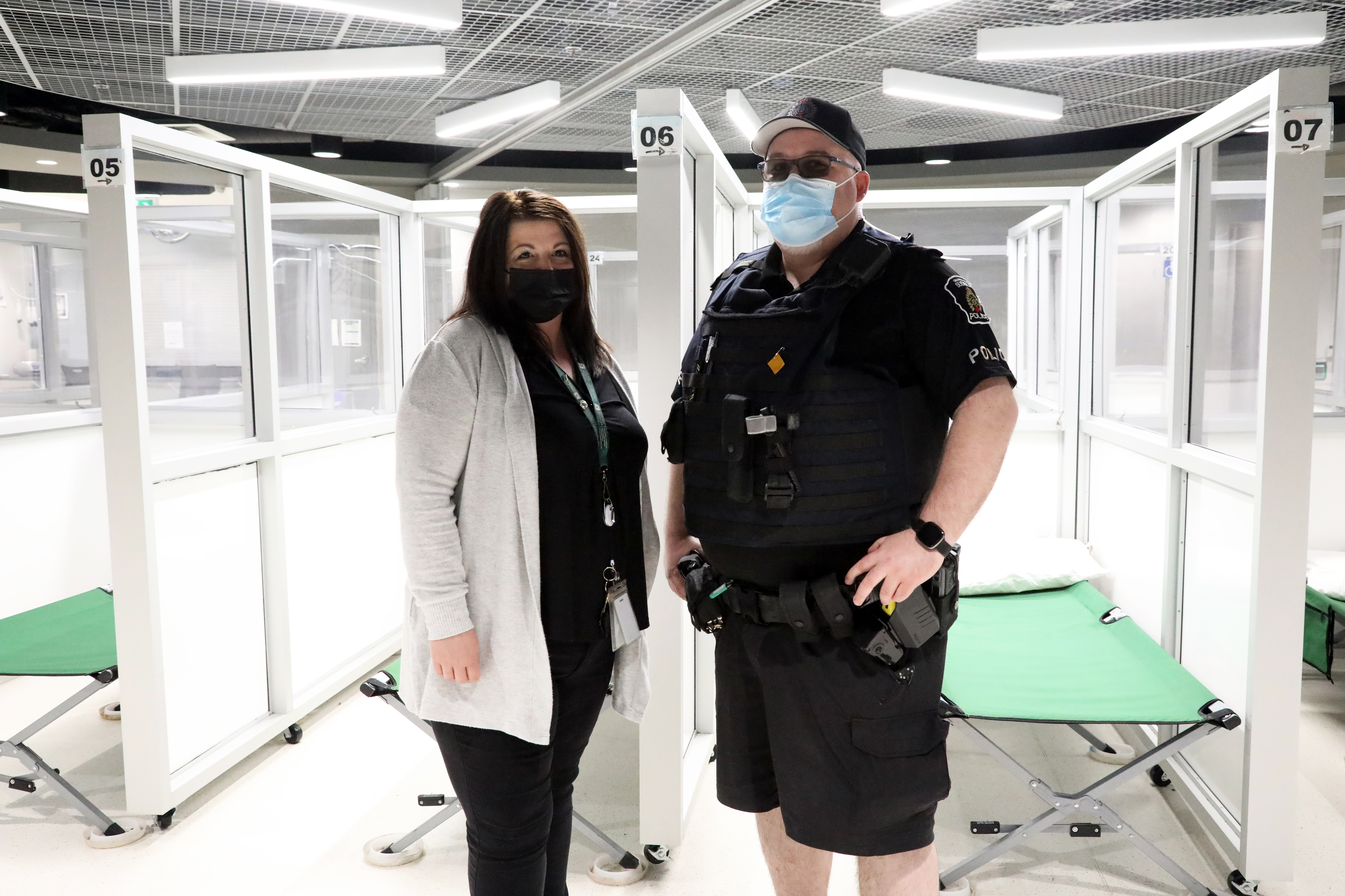 woman and man standing in shelter