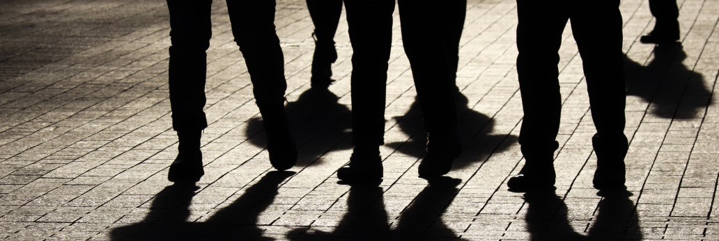 group of people walking at night